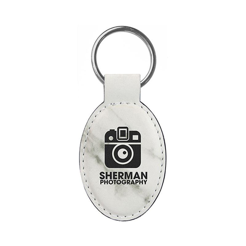 Laserbarer ovaler Schlüsselanhänger aus Kunstleder Laserbarer ovaler Schlüsselanhänger aus Kunstleder